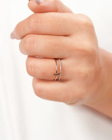 Open bar lab grown diamond bypass ring worn on hand in rose gold