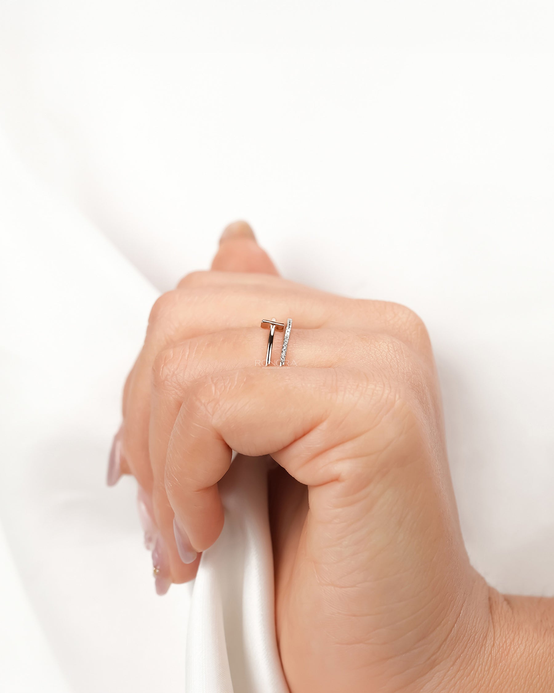 Open bar lab grown diamond bypass ring worn with white silk