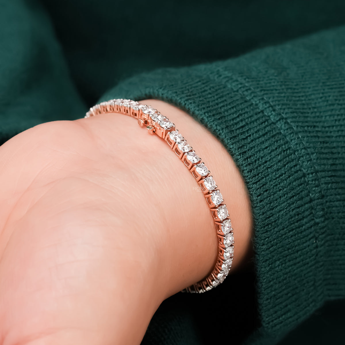 Close-up round lab grown diamond tennis bracelet on wrist
