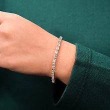 Emerald lab grown diamond tennis bracelet worn with green sleeve
