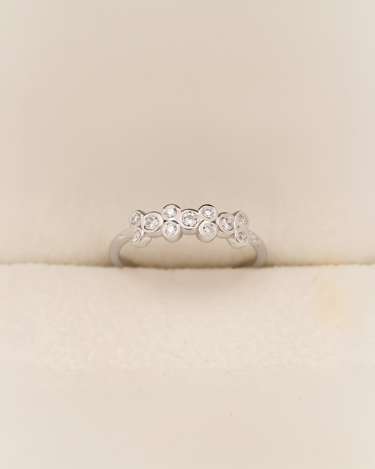 White metal five-stone band with round lab grown diamonds in Ronora box
