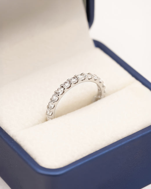 Lunette round lab grown diamond eternity band in white metal inside Ronora box