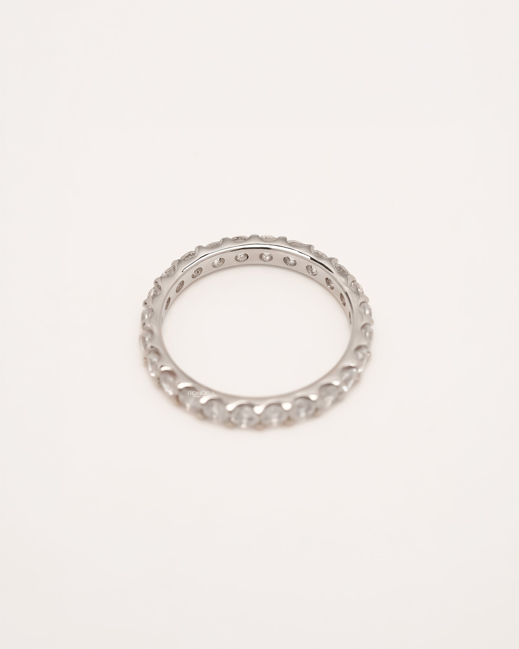 Back view of round lab grown diamond eternity band showing band and gallery detail