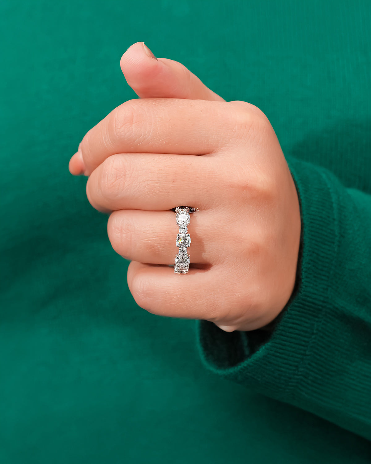 round lab grown diamond eternity band worn with luxury styling in white gold