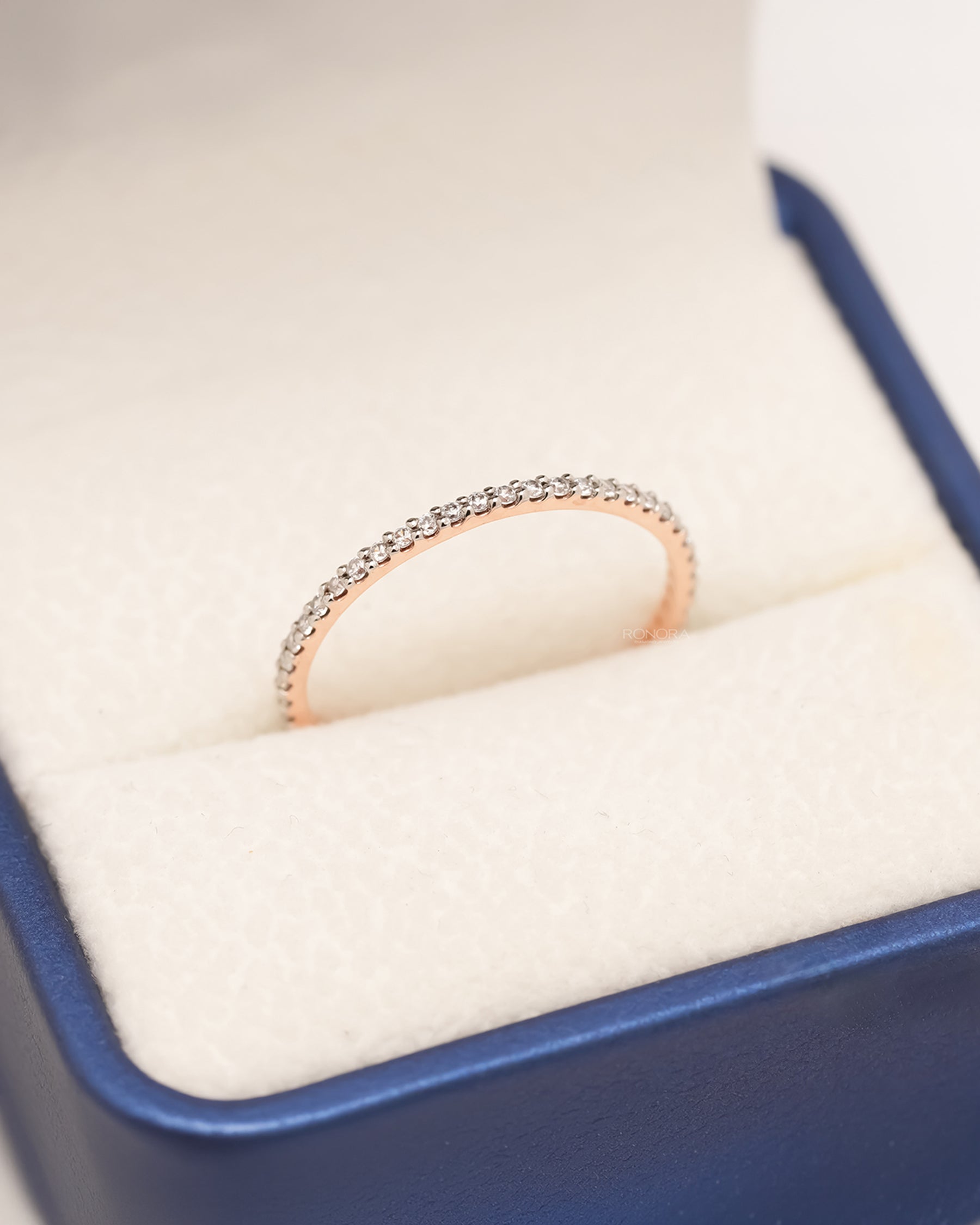 Aveline slim lab grown diamond pavé eternity band in rose gold inside Ronora box
