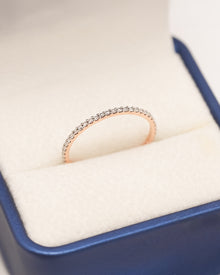 Aveline slim lab grown diamond pavé eternity band in rose gold inside Ronora box