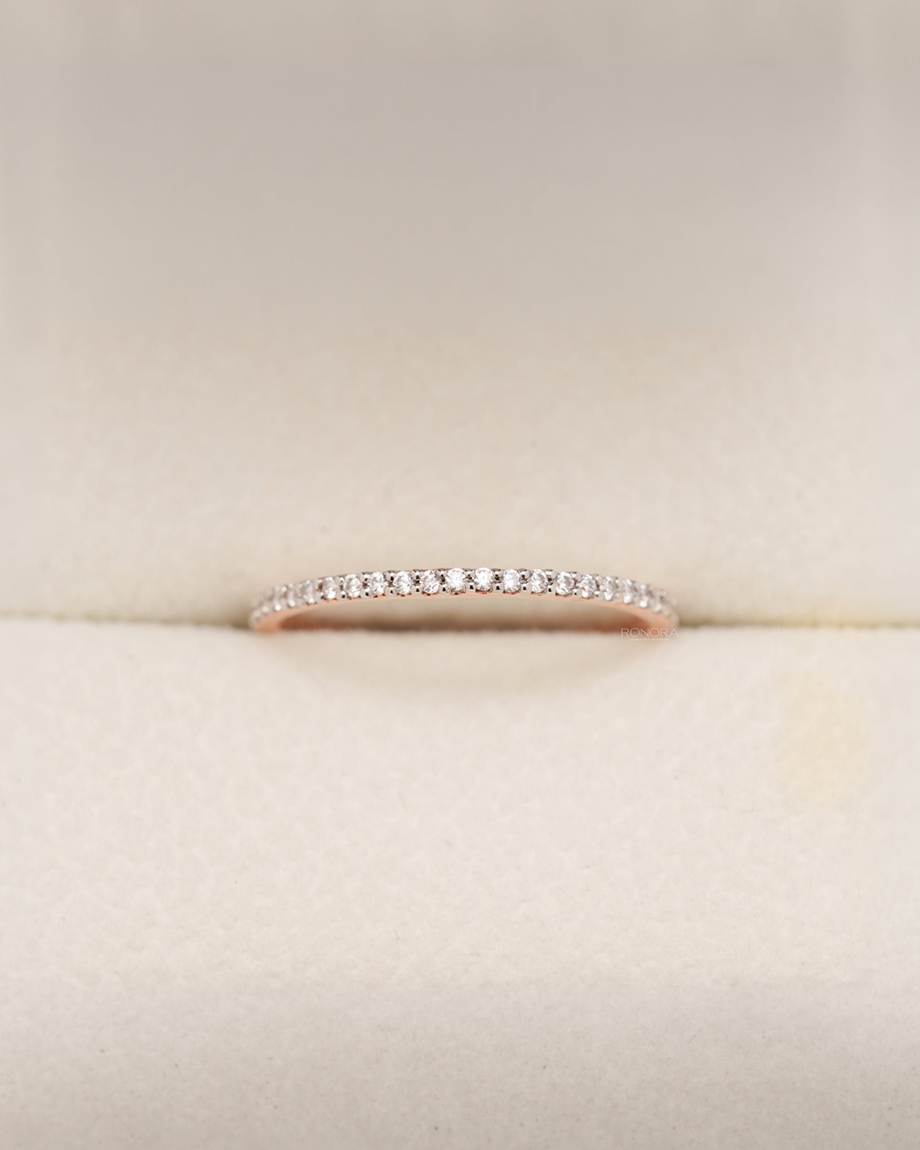 Rose gold pavé eternity band with round lab grown diamonds in Ronora box