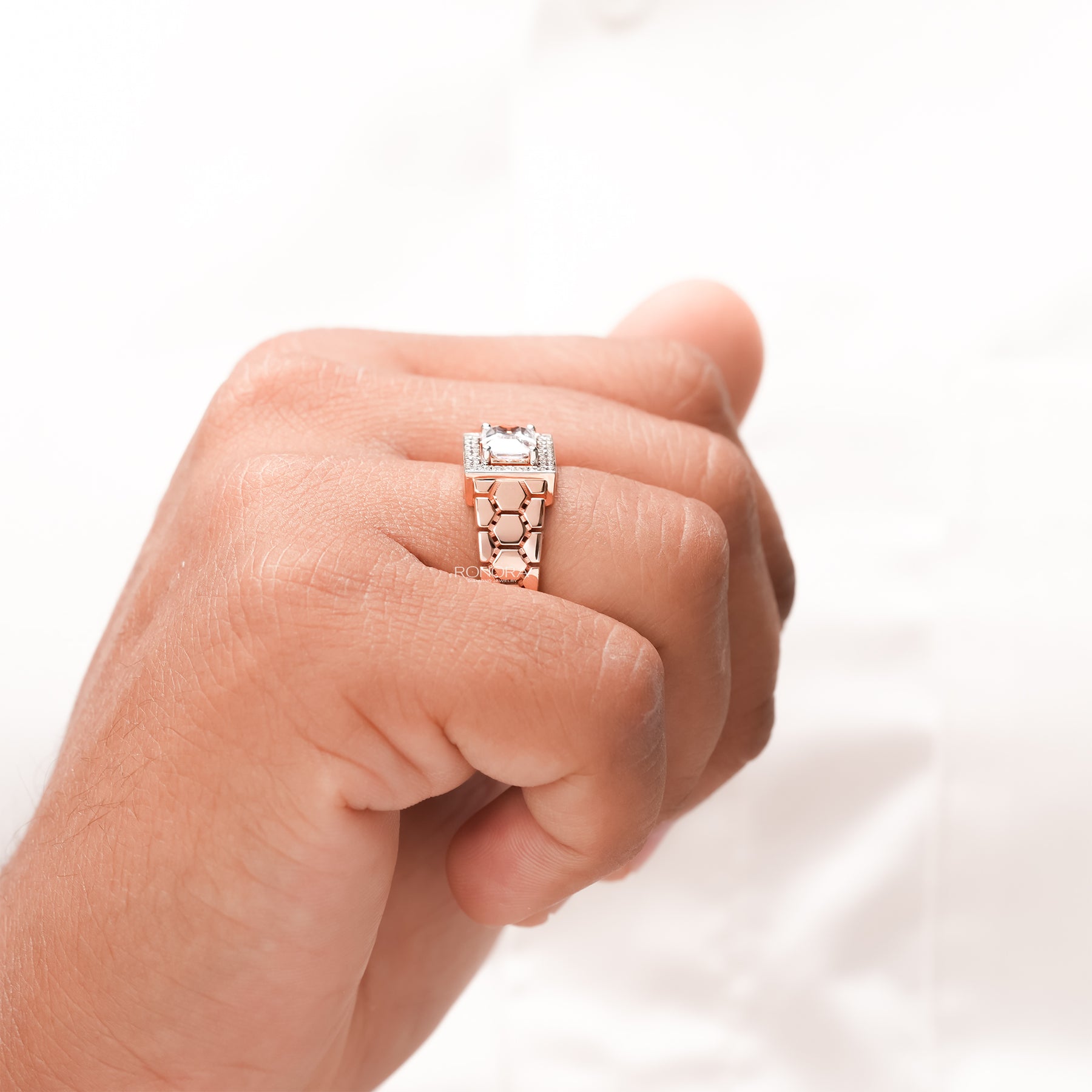 Side profile of emerald moissanite halo men's ring showing ring setting