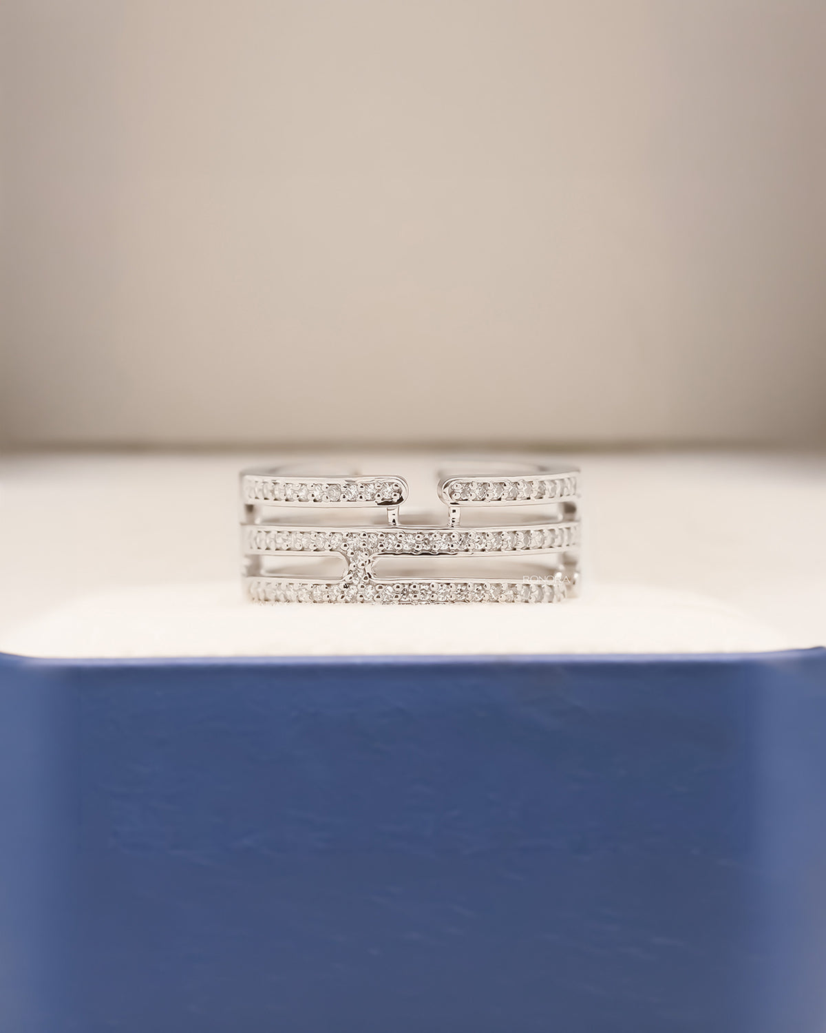 Angled view of wide lab grown diamond pavé band showing multi-row pavé setting