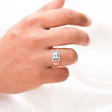 emerald moissanite halo men's ring worn on hand in rose gold