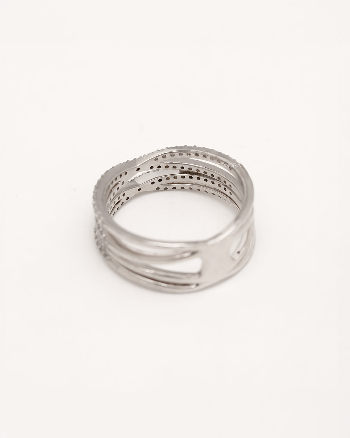 Back view of four-band lab grown diamond crossover ring showing open band structure