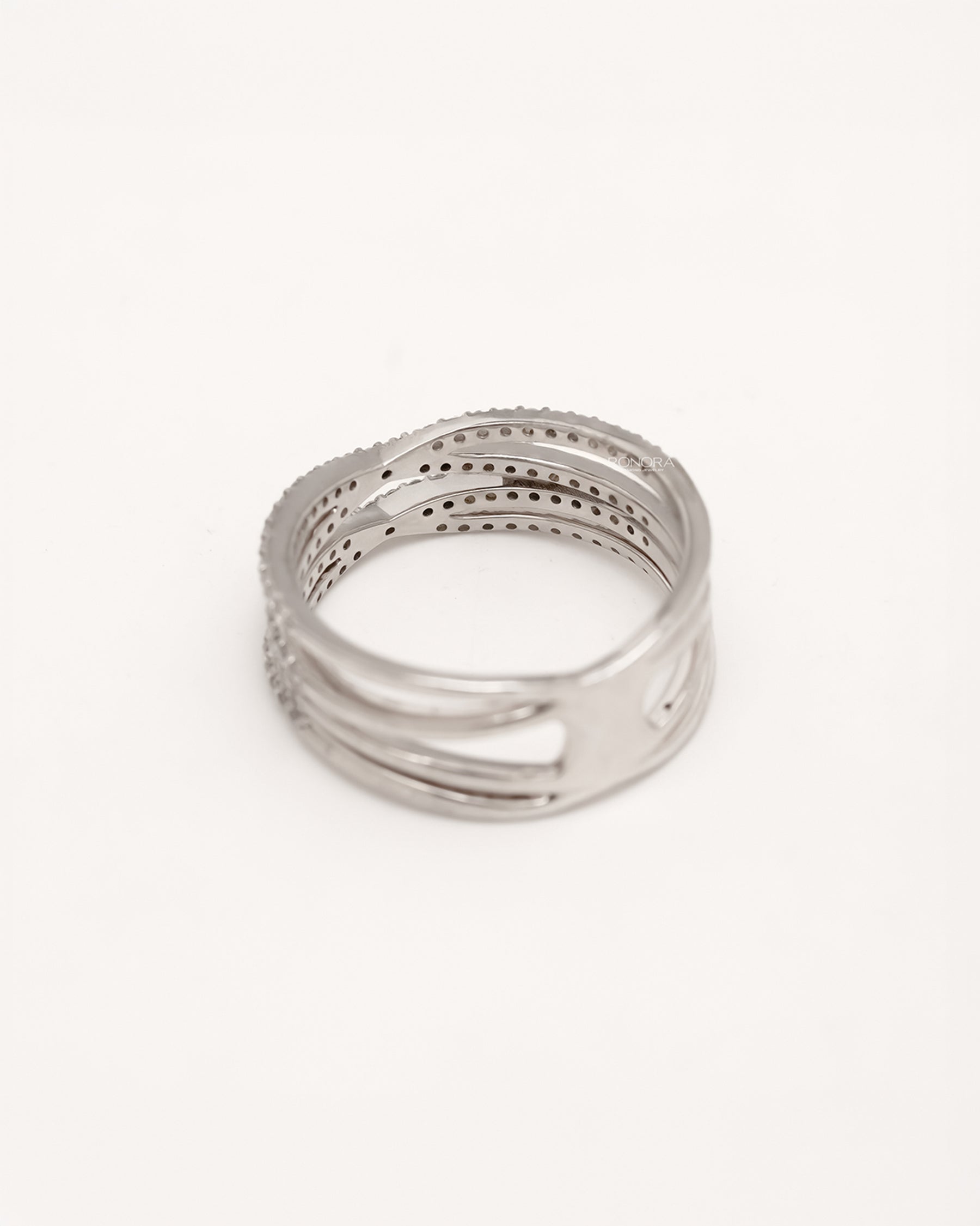 Back view of four-band lab grown diamond crossover ring showing open band structure