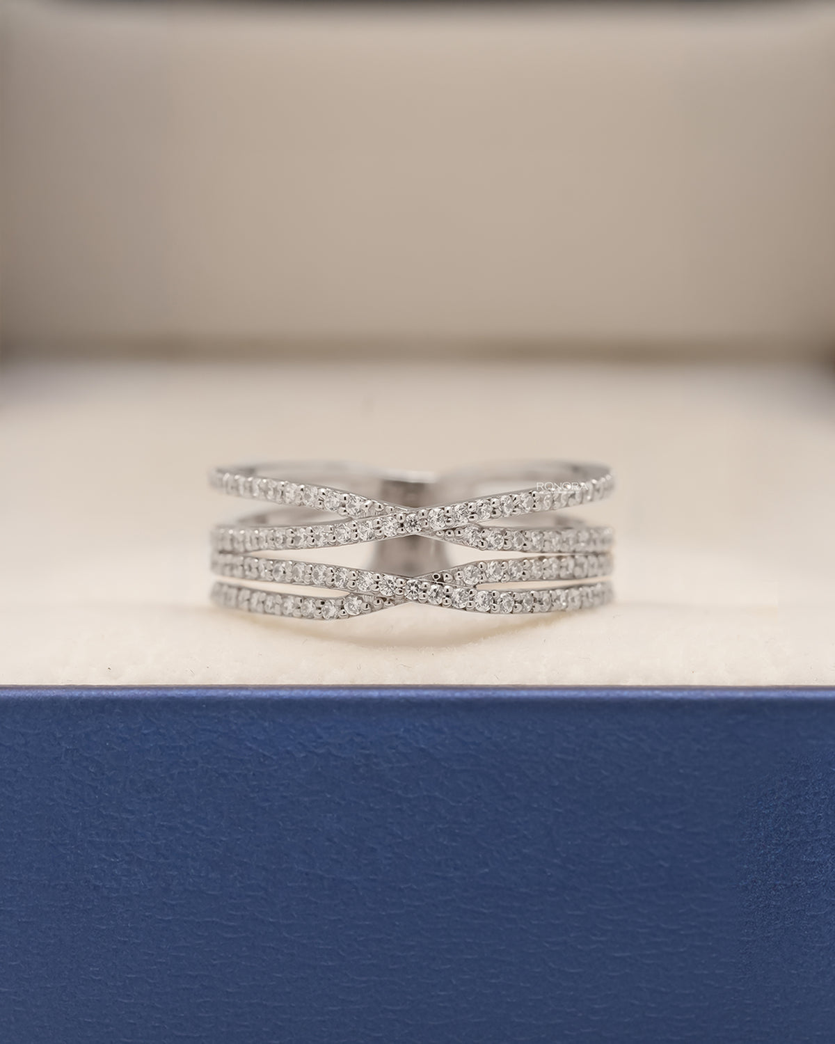 Seraphine four-band lab grown diamond pavé crossover ring in white metal