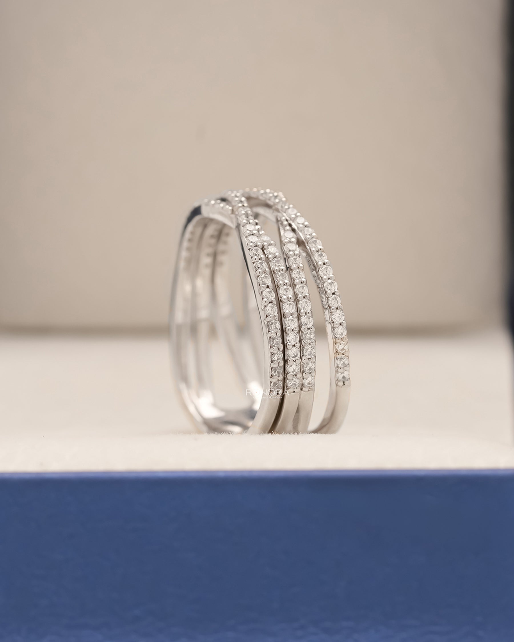 Side profile of lab grown diamond pavé crossover ring showing stacked bands