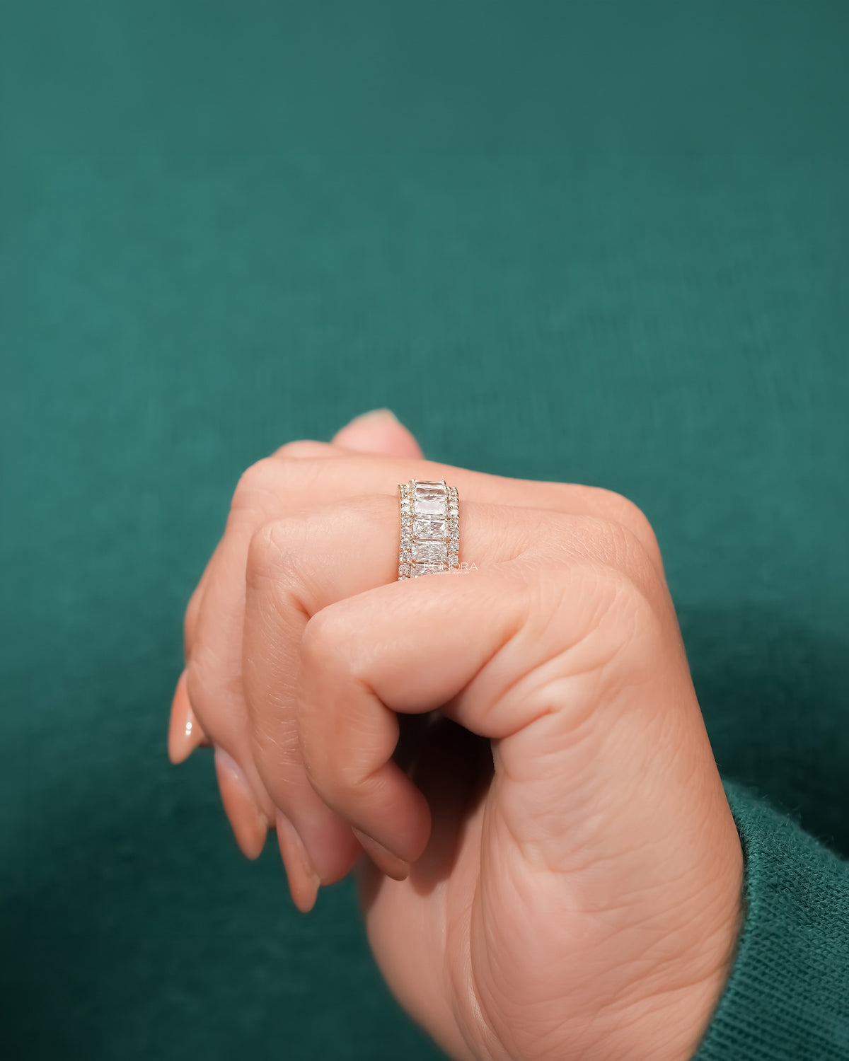 radiant lab grown diamond eternity band worn with luxury styling in yellow gold