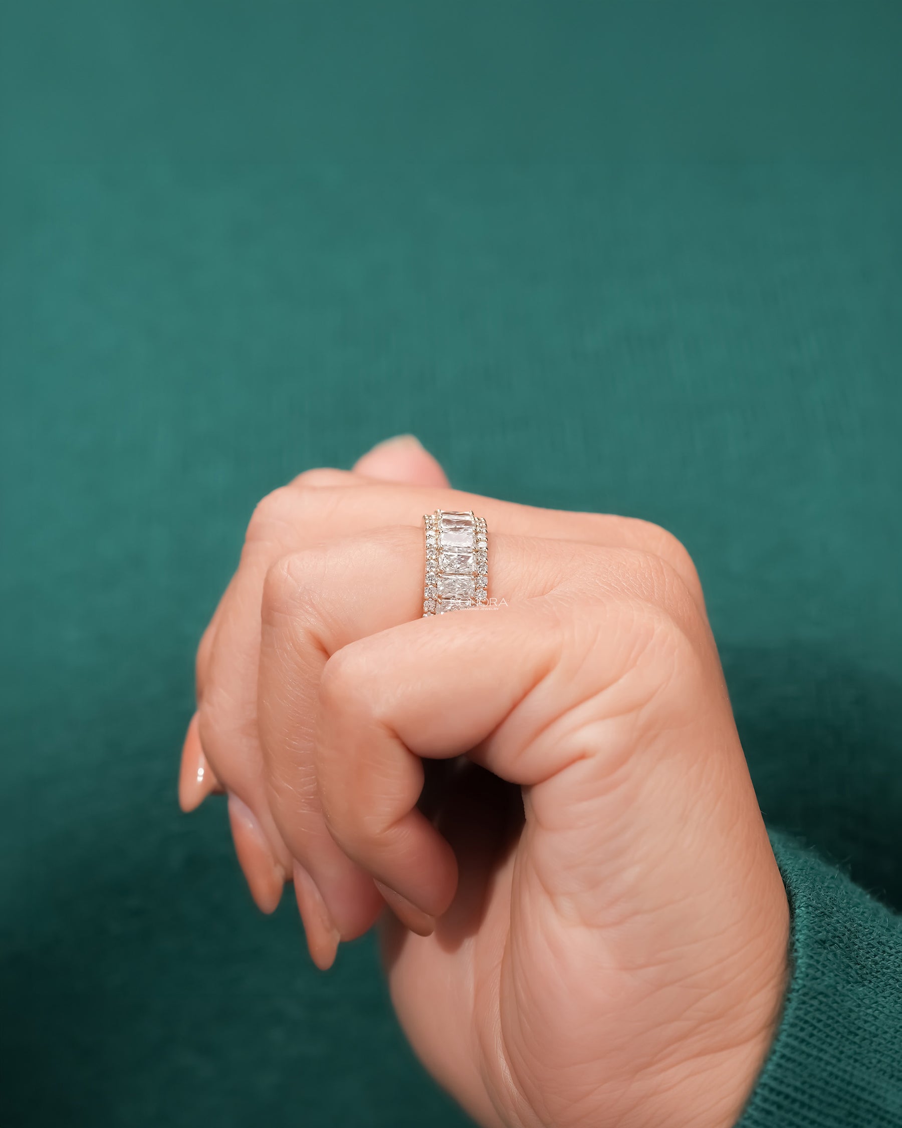 radiant lab grown diamond eternity band worn with luxury styling in yellow gold