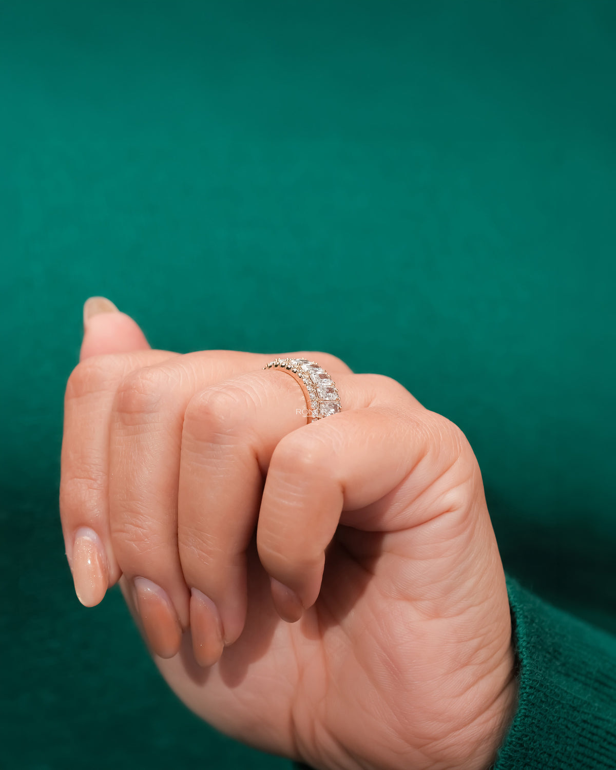 Side profile of radiant lab grown diamond eternity band showing ring setting