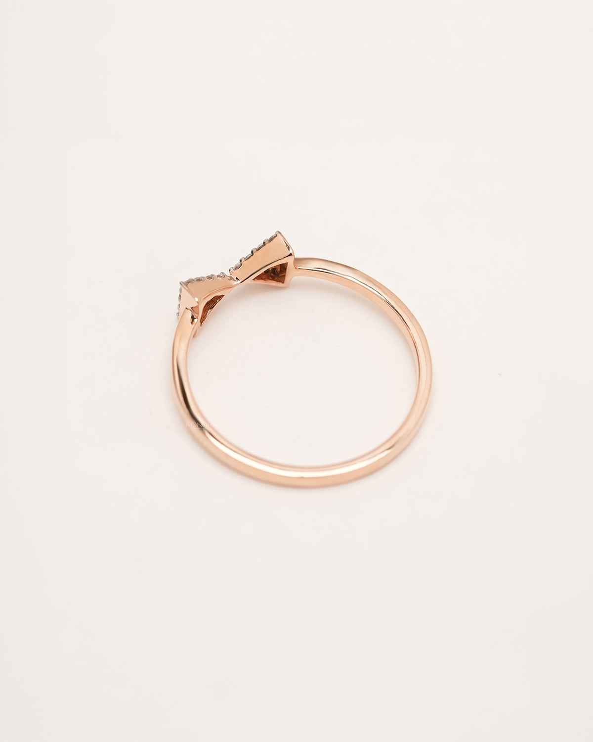 Back view of rose gold pavé bow lab grown diamond ring showing slim band