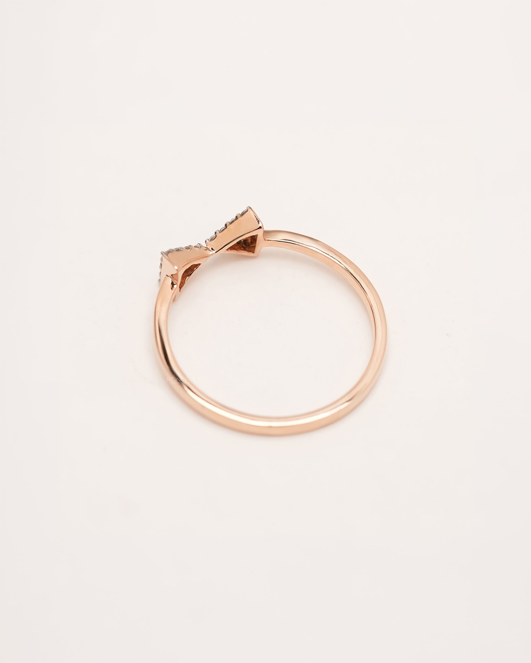 Back view of rose gold pavé bow lab grown diamond ring showing slim band