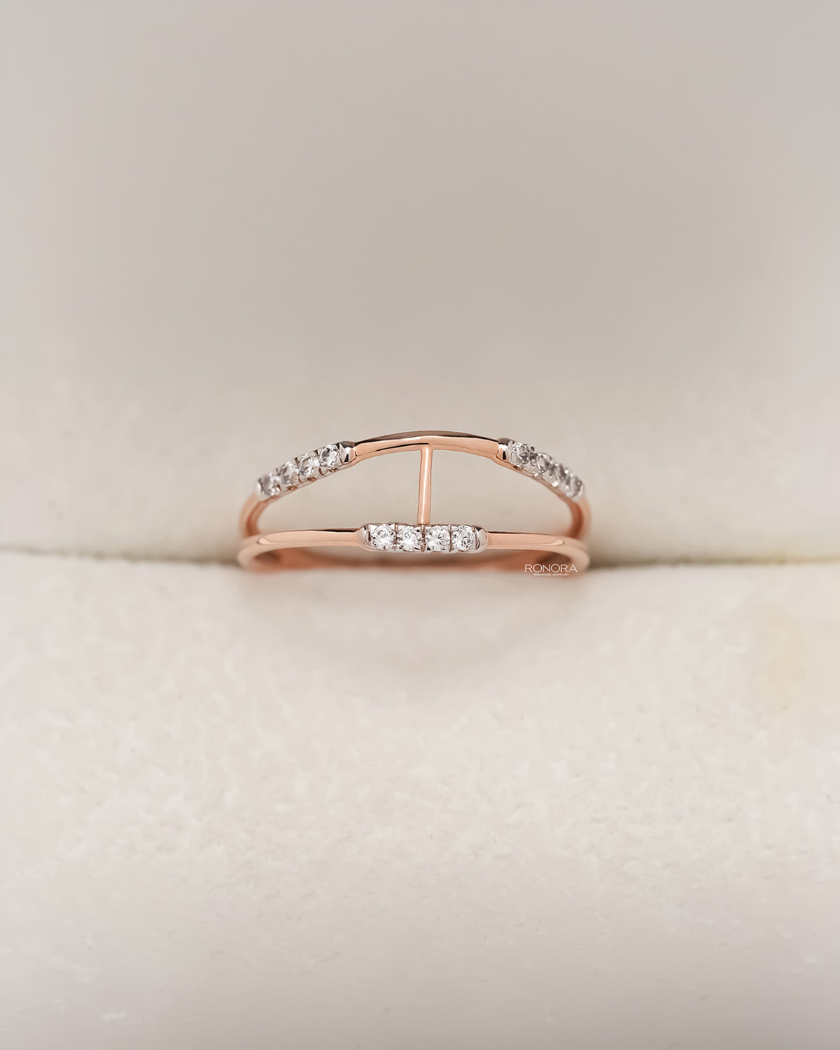 Rose gold open bypass ring with round pavé lab grown diamonds in Ronora box