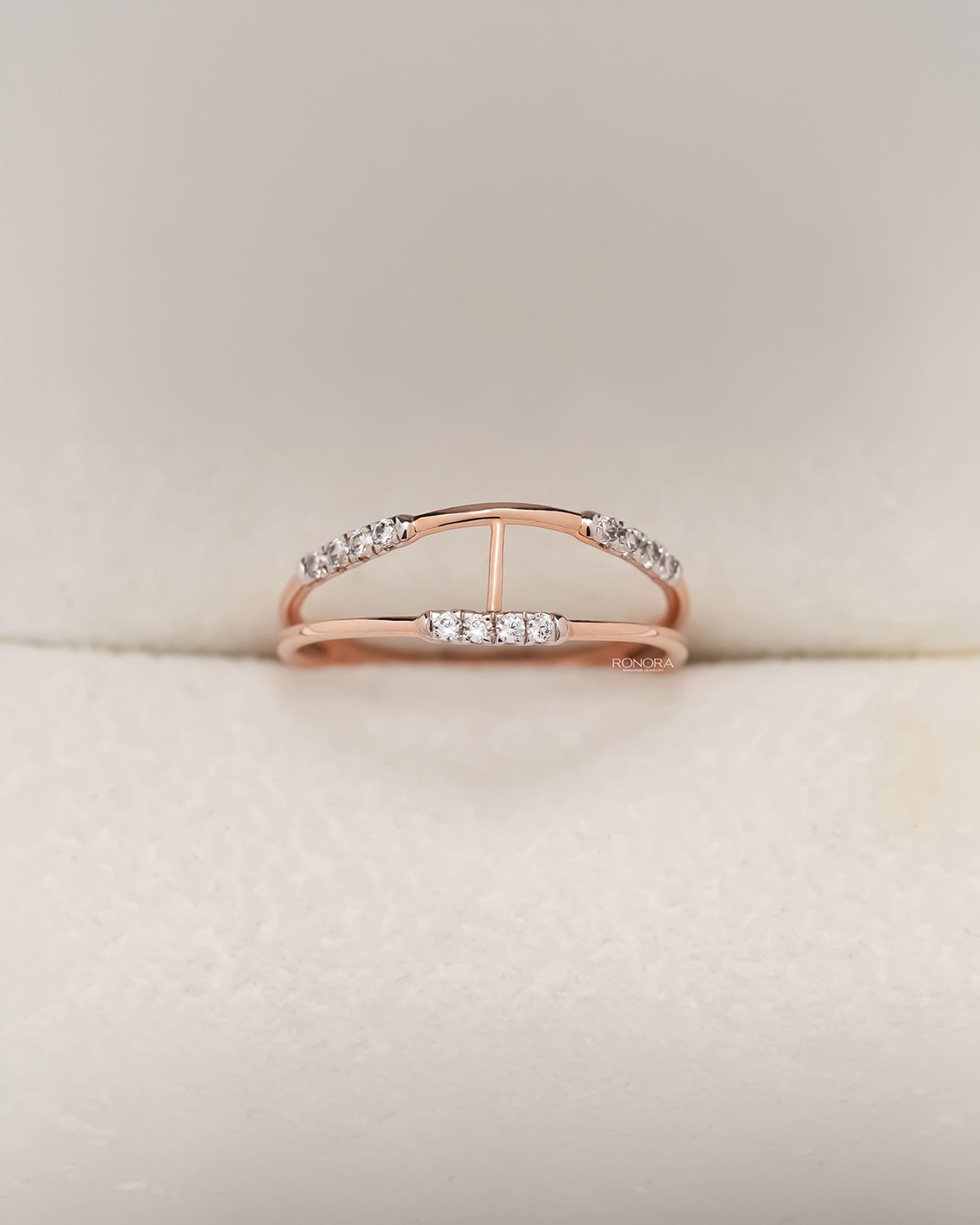 Rose gold open bypass ring with round pavé lab grown diamonds in Ronora box
