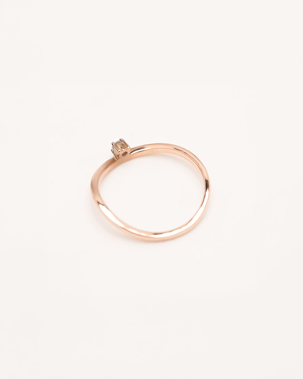Back view of minimal rose gold lab grown diamond solitaire ring