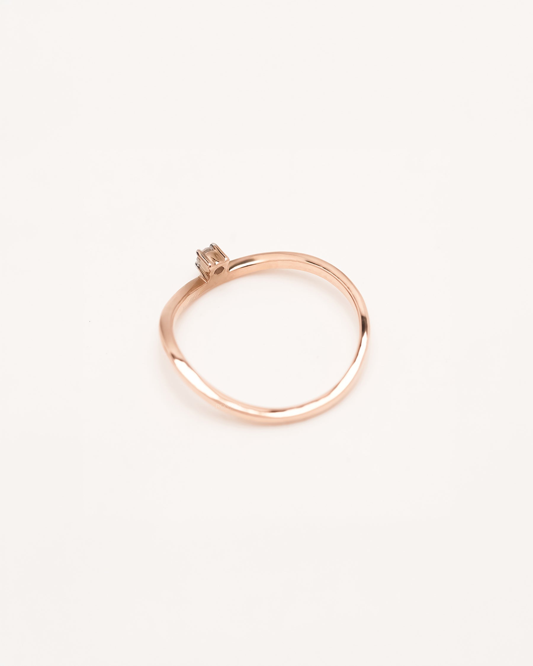 Back view of minimal rose gold lab grown diamond solitaire ring