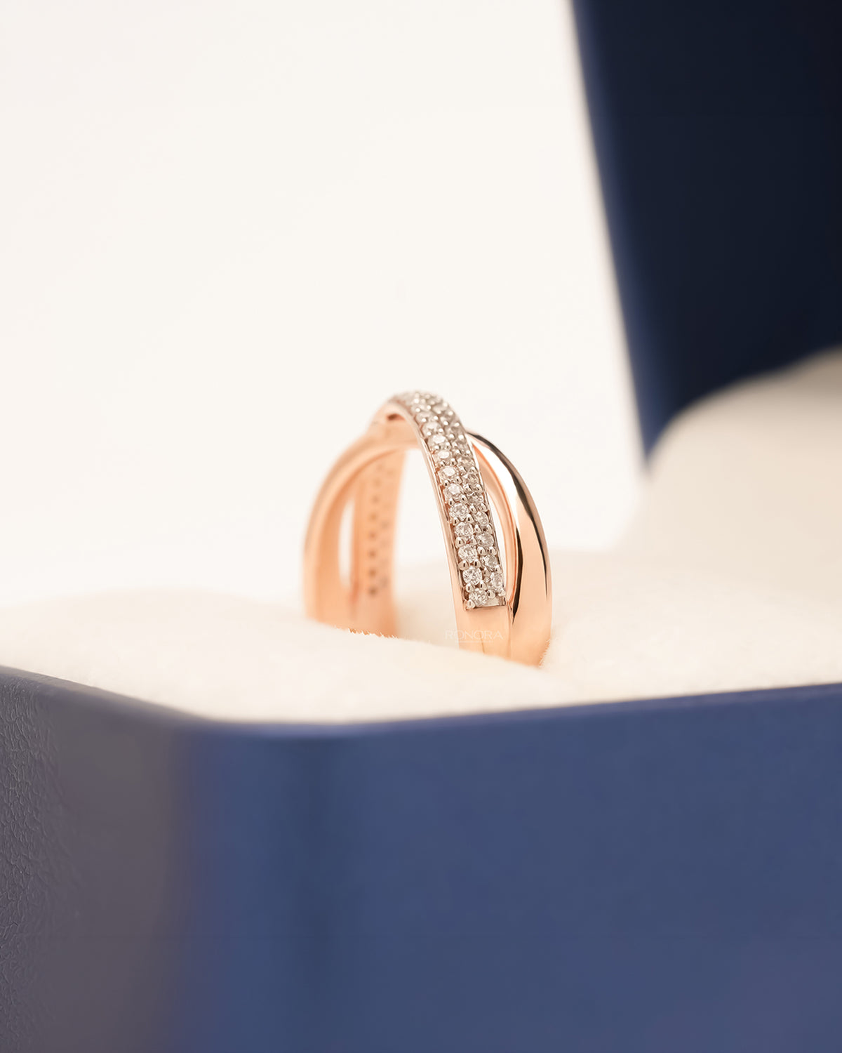 Side profile of rose gold double-row pavé band showing raised diamond rows