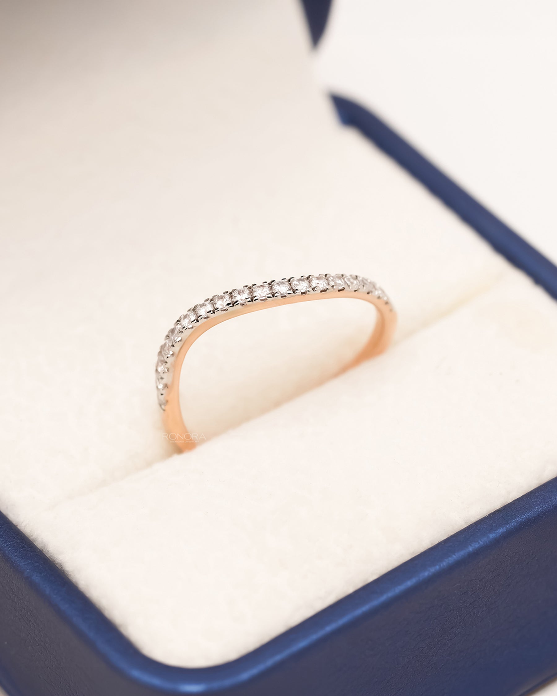 Rose gold curved pavé lab grown diamond band in Ronora ring box