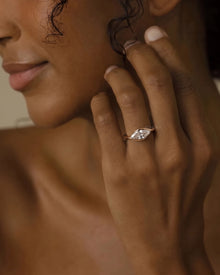 Model wearing the marquise bezel lab grown diamond ring in yellow gold