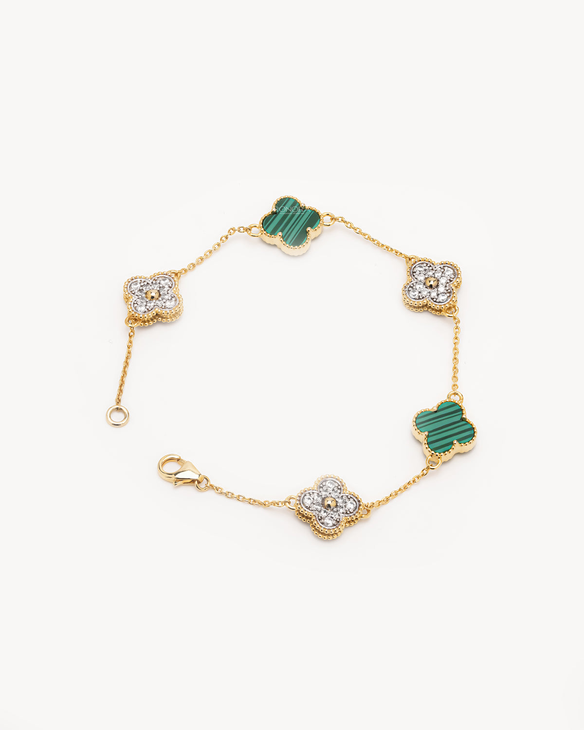 Clover malachite bracelet with pave diamond clovers on a yellow gold chain