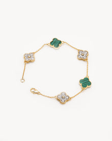 Clover malachite bracelet with pave diamond clovers on a yellow gold chain