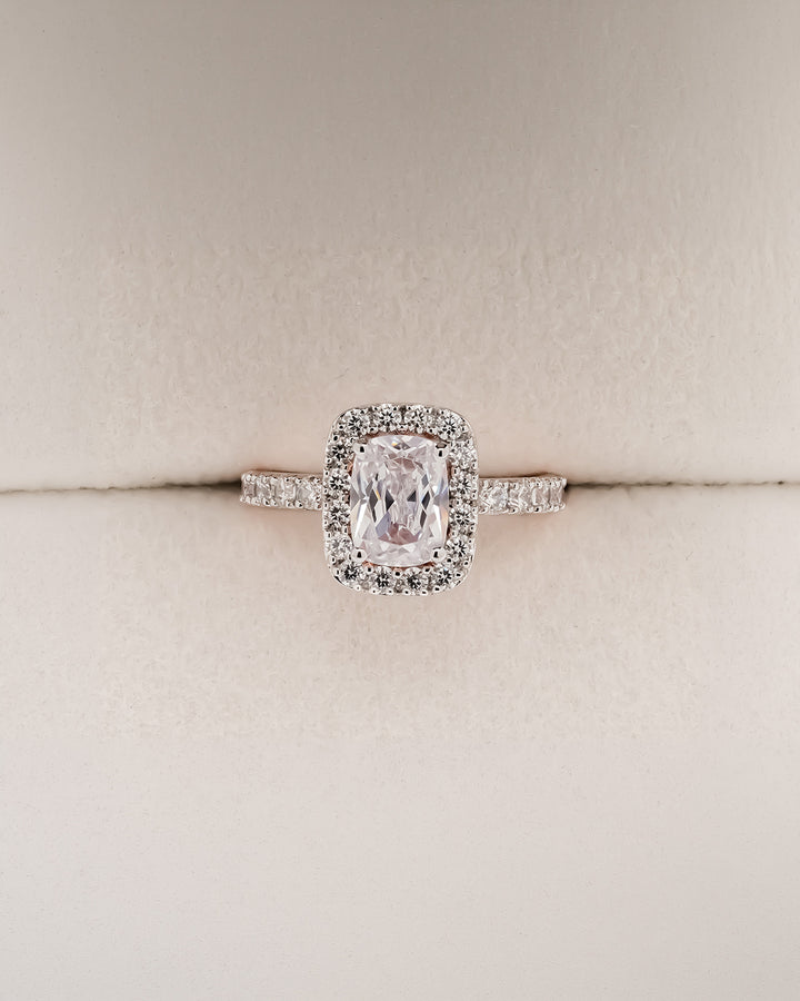 Cushion moissanite halo engagement ring in rose gold inside Ronora box