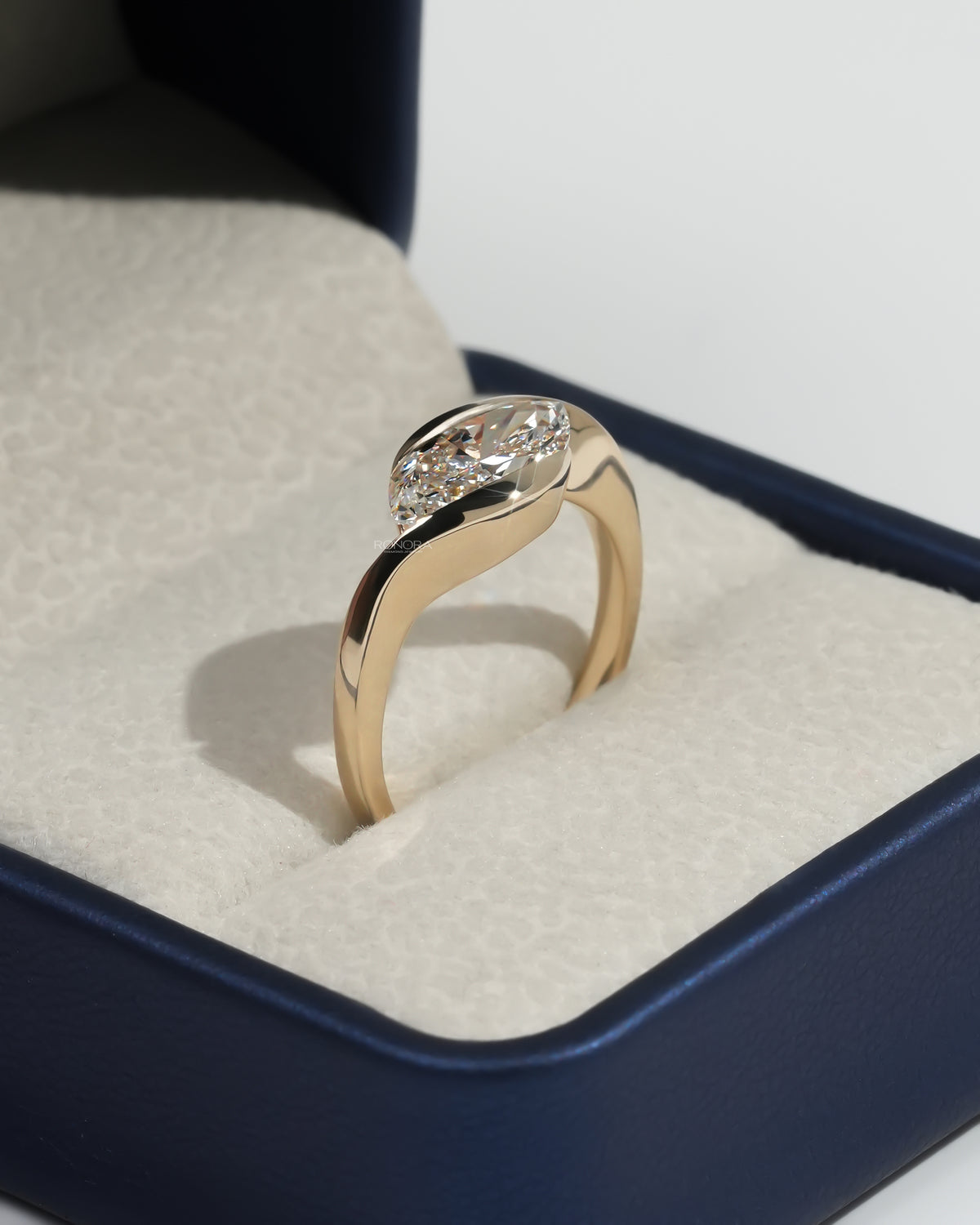 Side profile of the marquise bezel lab grown diamond ring showing the tapered band