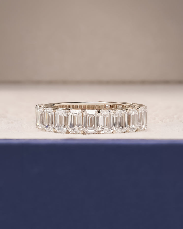 Emerald cut lab grown diamond eternity band in white gold inside Ronora box