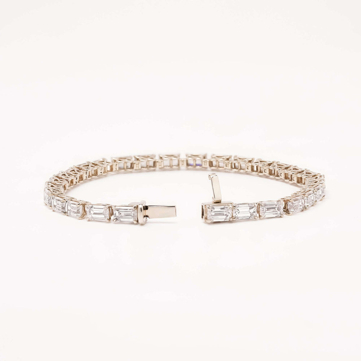 Open emerald cut lab grown diamond tennis bracelet with clasp