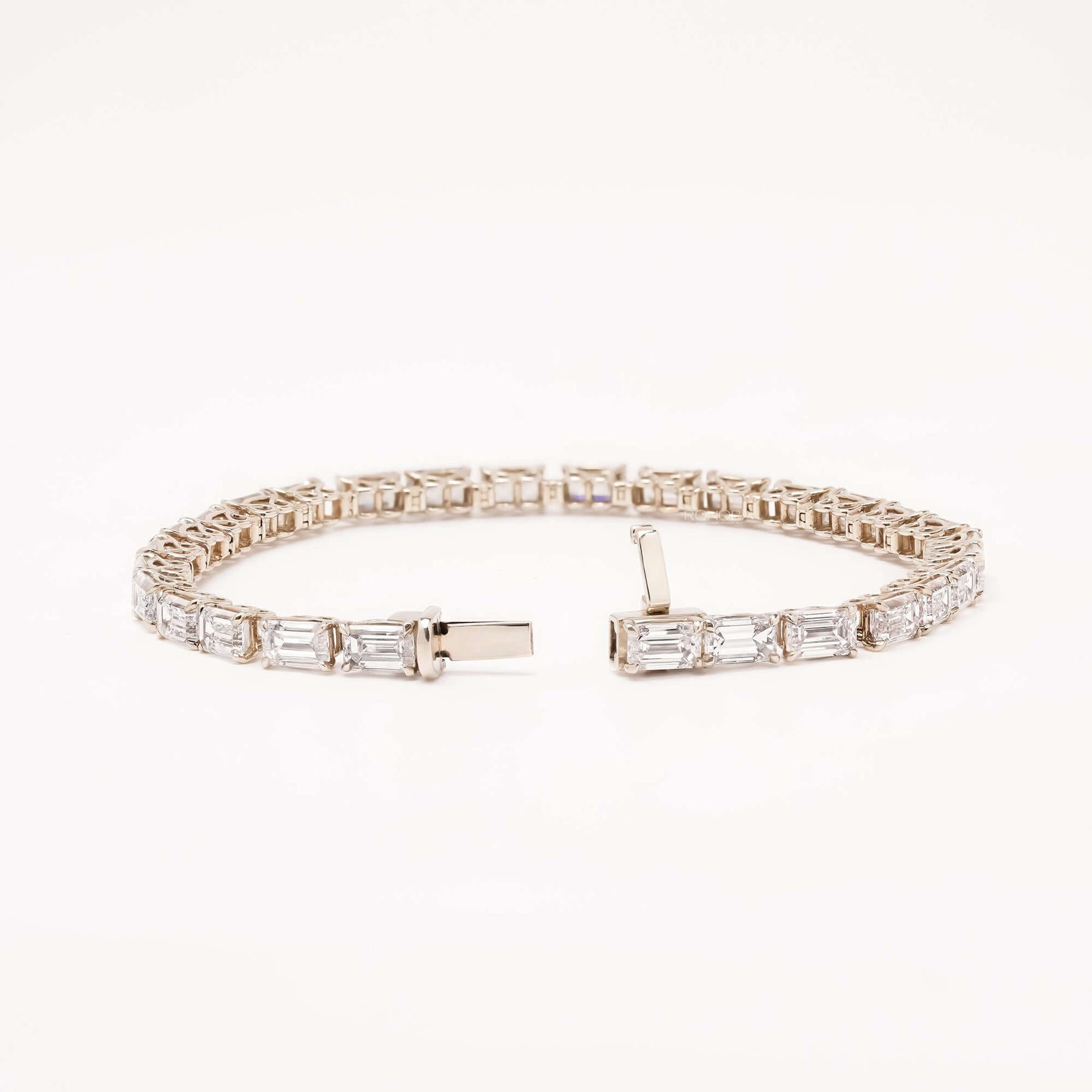 Open emerald cut lab grown diamond tennis bracelet with clasp