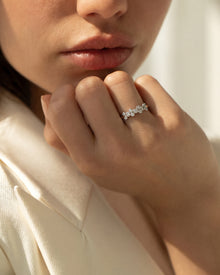 Round bezel five stone lab grown diamond band worn on hand in white metal - Ronora
