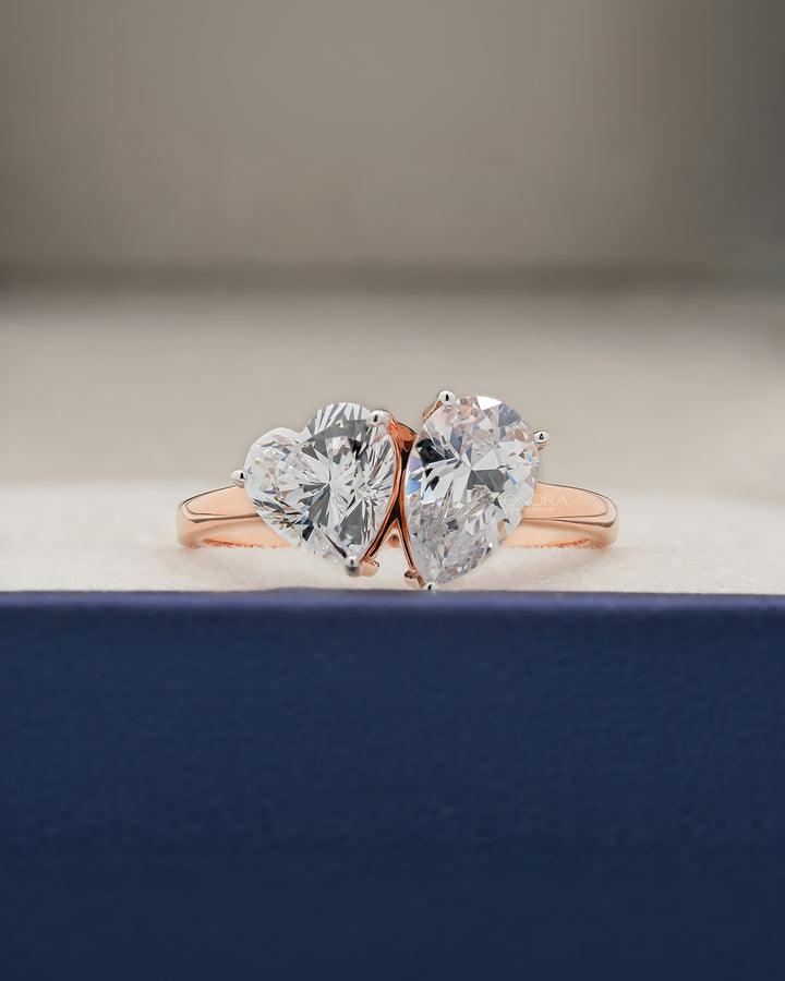 Amorette heart pear moissanite toi et moi ring in rose gold inside Ronora box