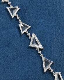 Close-up of the multi shape lab grown diamond bracelet on blue velvet