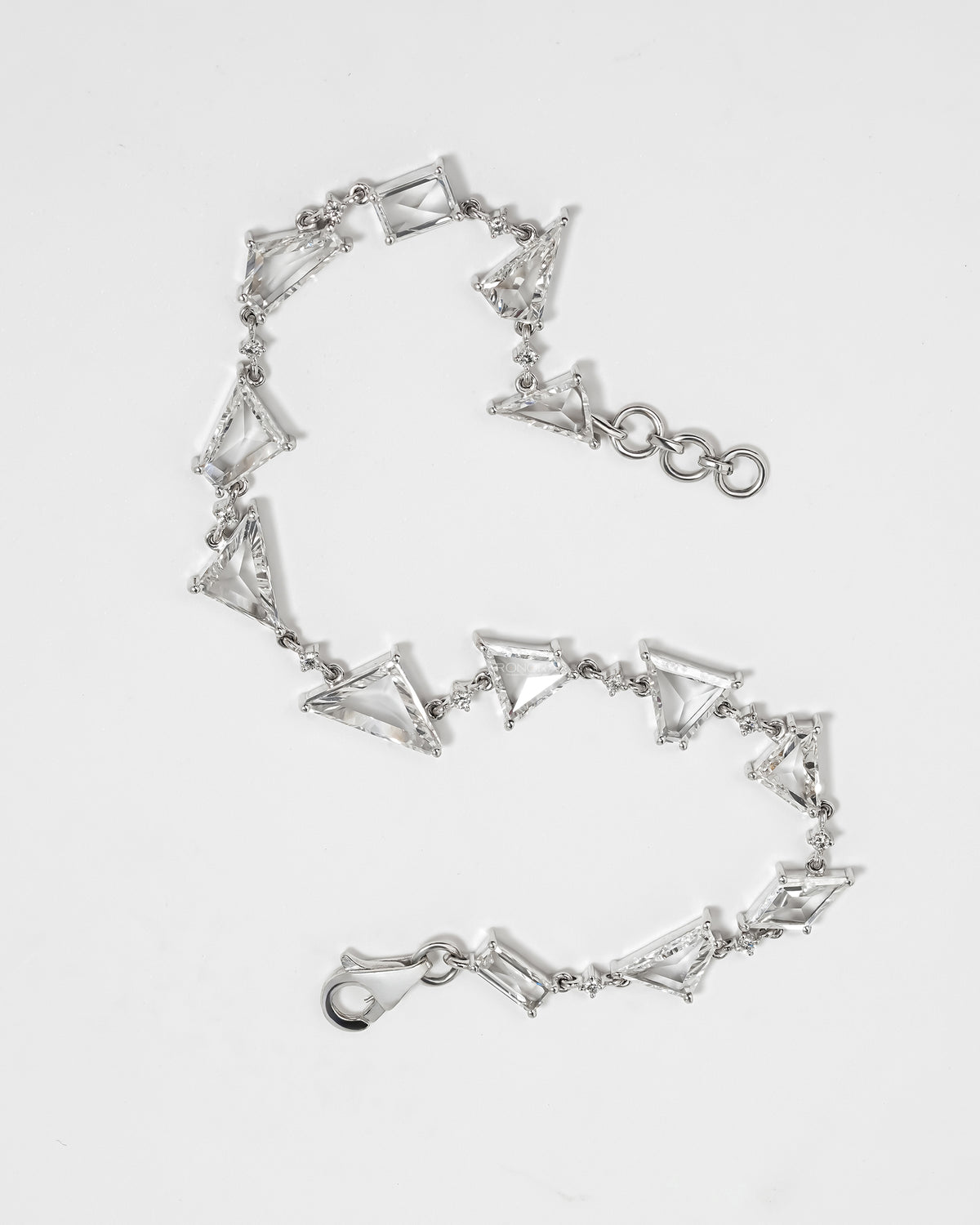 Multi shape lab grown diamond bracelet laid flat showing kite and trillion links