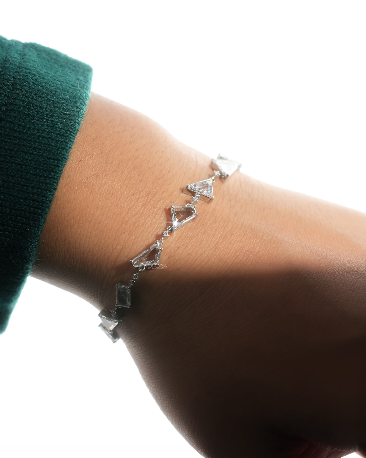 Multi shape lab grown diamond bracelet fastened on the wrist