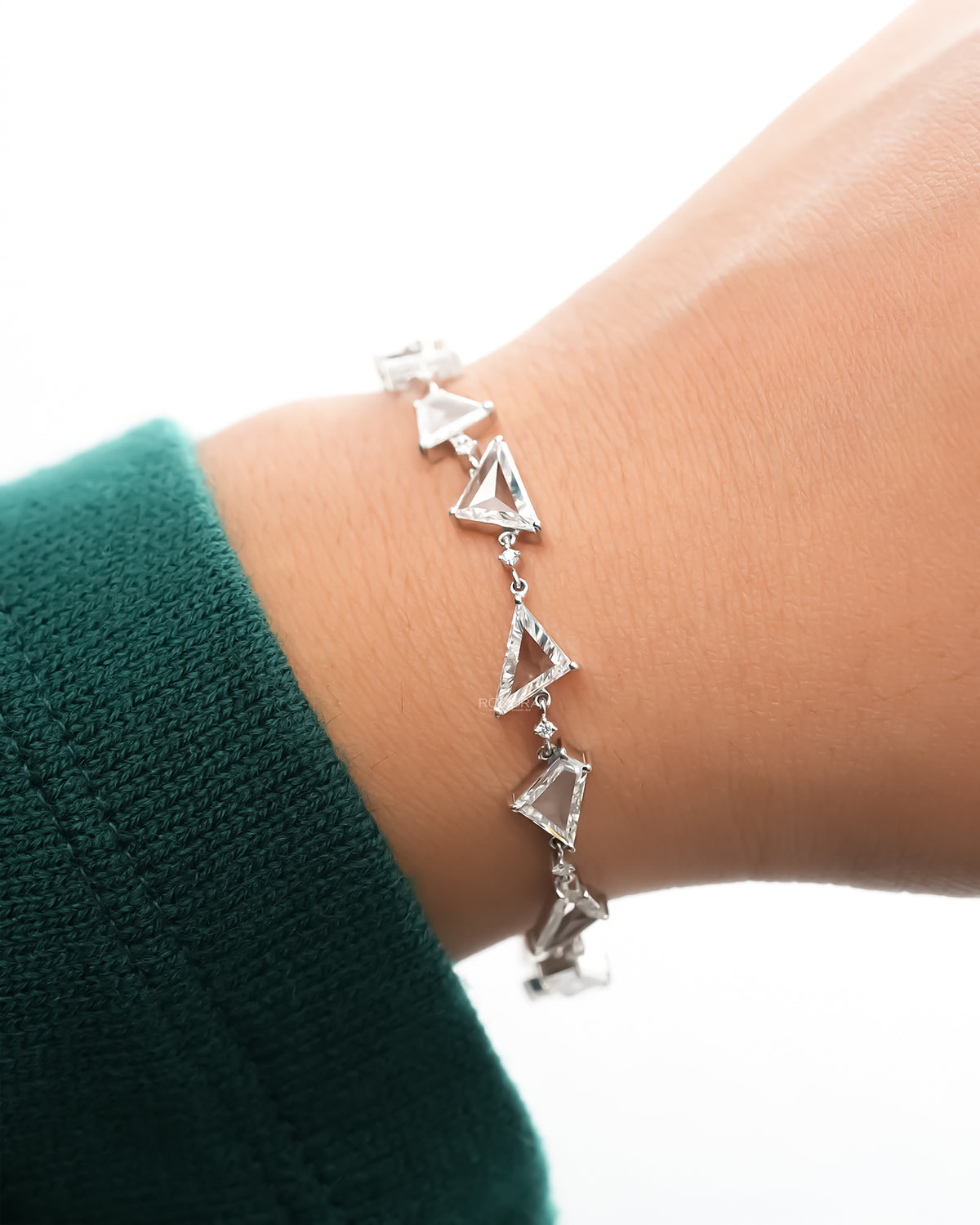 Multi shape lab grown diamond bracelet worn on the wrist from above