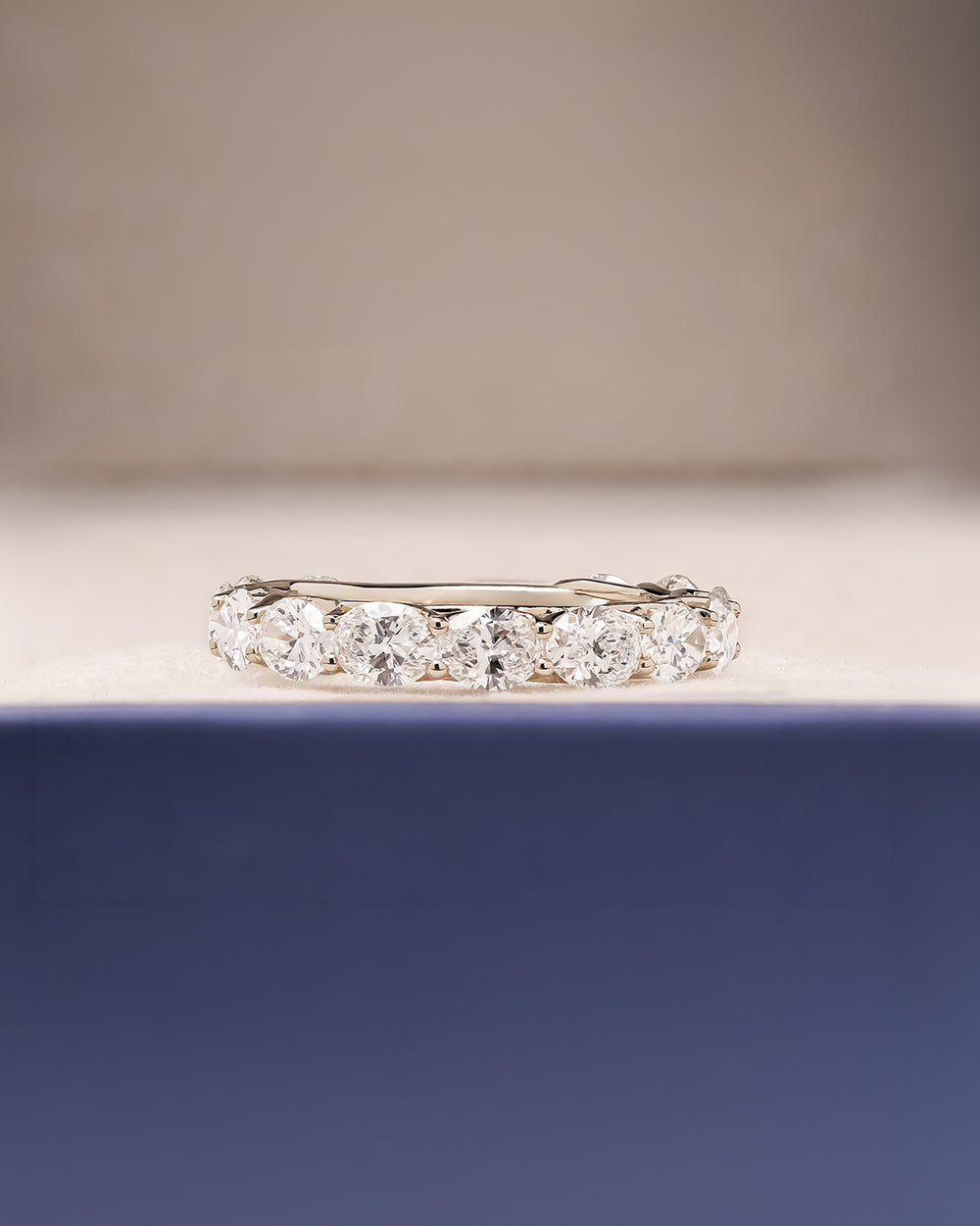 Margaux oval lab grown diamond eternity band in white gold inside Ronora box