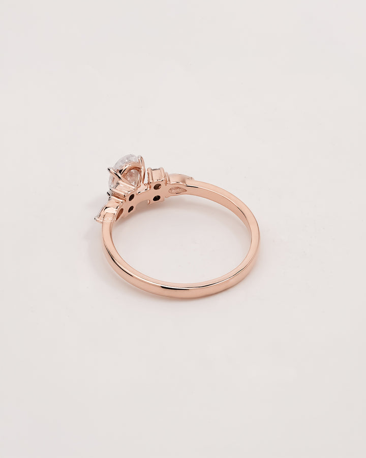 Back view of oval pear moissanite cluster ring showing band detail