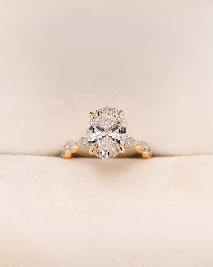 Oval marquise lab grown diamond three stone ring in yellow gold inside Ronora box