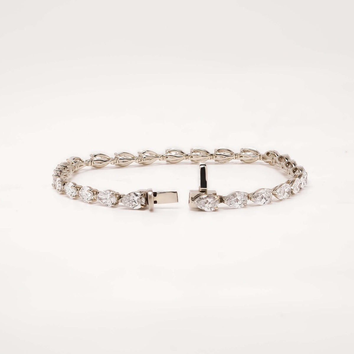 Open pear lab grown diamond tennis bracelet with clasp