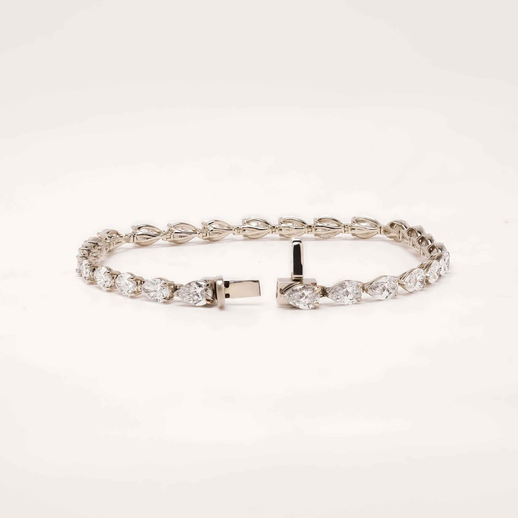 Open pear lab grown diamond tennis bracelet with clasp