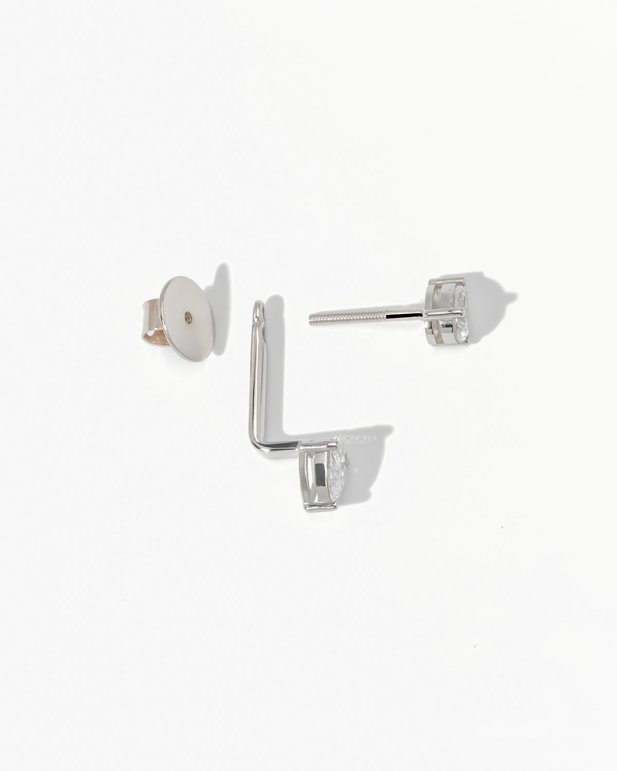 Detail of a pear lab grown diamond ear jacket earring in white gold with the screw back post and round back plate