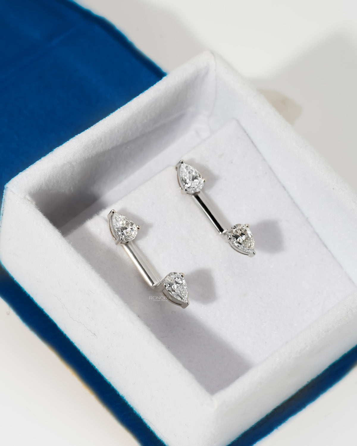 Pear lab grown diamond ear jacket earrings in white gold, two pear diamonds per earring, in a white velvet box